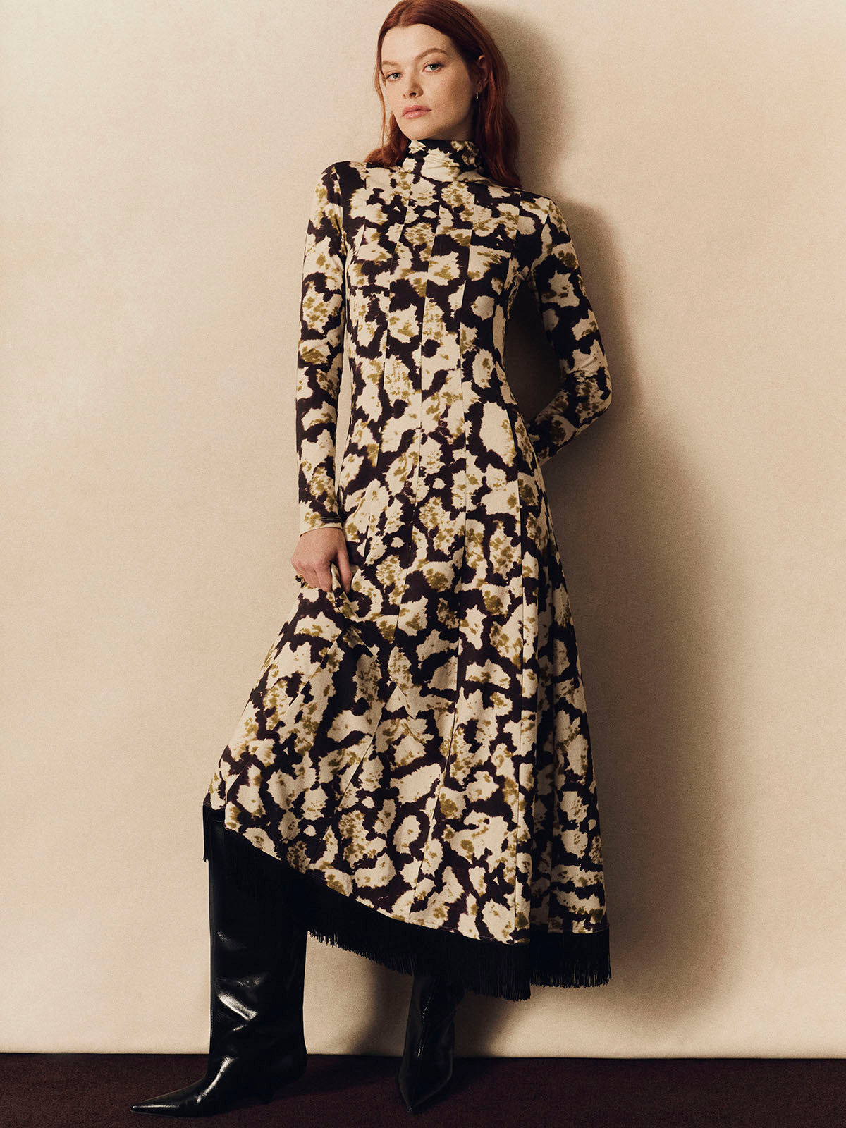 Troy Midi Dress
Spotted, fitted, fringed